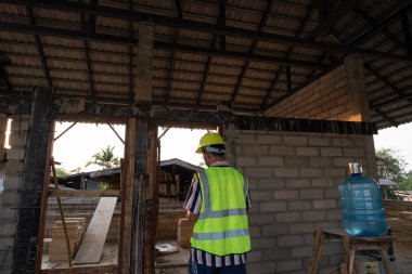 Engineer man working on construction site new house building inspector man