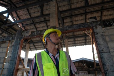 Engineer man working on construction site new house building inspector man