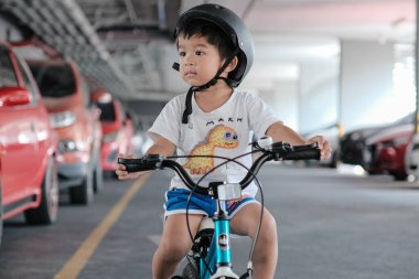 Preschool boy learn to rude bicycle wear helmet exercise activity