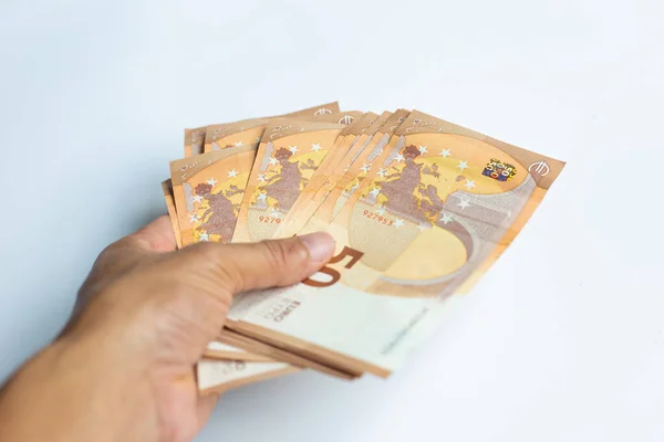 Hombres Mano Mantenga Euro Paquete Dinero Sobre Fondo Blanco — Foto de Stock