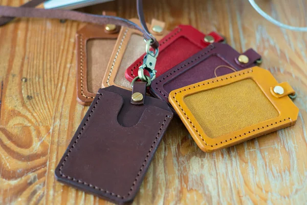 stock image Leather id card holder handmade craftmanship working on wood