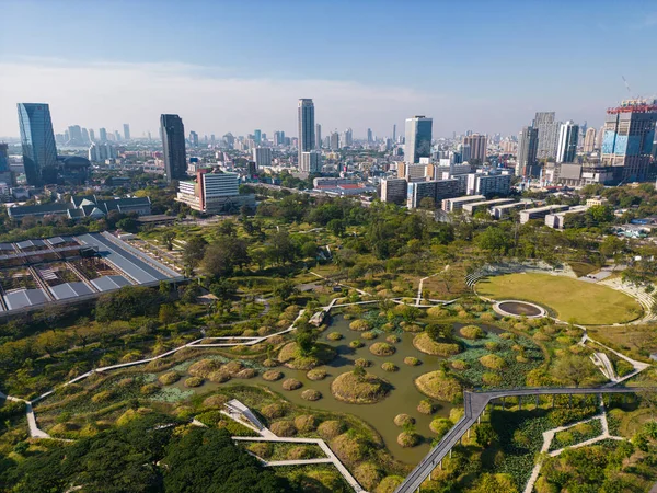 stock image Benjakitti Forest public Park new landmark of central Bangkok with office building aerial view in Bangkok, Thailand.