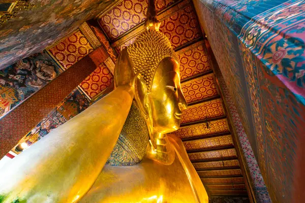 stock image Golden reclining buddha statue in pagoda sightseeing travel in Bangkok Thailand