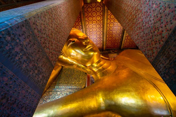 stock image Golden reclining buddha statue in pagoda sightseeing travel in Bangkok Thailand