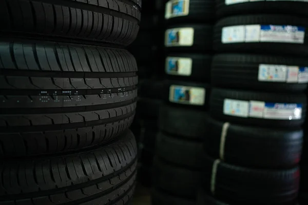 Bundle of new car tire on shelf in garage car shop transport industry