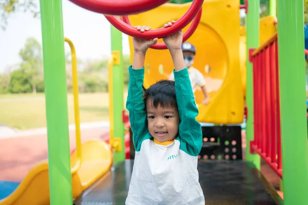 stock image Happy asian boy climbing in outdoor playground public park outdoor activity