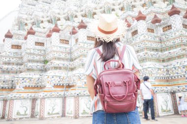 Asian woman travel in buddha temple backpacke tourist in Bangkok Thailand