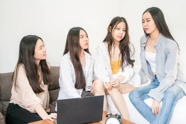 Business asian women group discussion business plan with laptop in home office