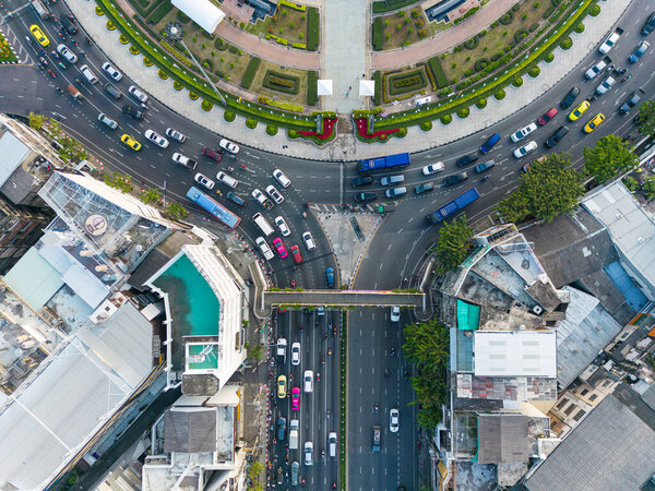 Aerial view circular junction road with office building car on trsansport road transport industry