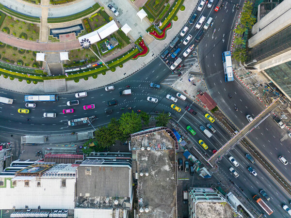 Aerial view circular junction road with office building car on trsansport road transport industry