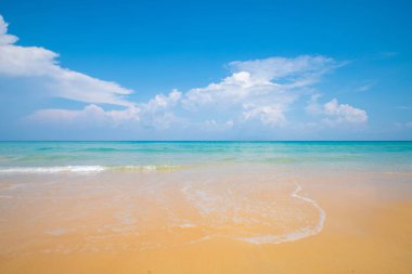 Serenity white snad sea wave beach against blue sky with cloud summer vacation
