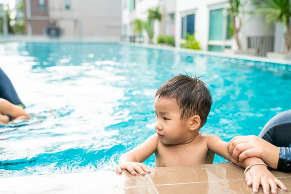 stock image Adorable little boy in condominium swimming pool, outdoor activity