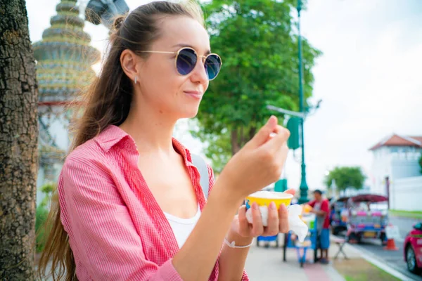 stock image Beautiful woman eat ice cream street food while travel in Bangkok Thailand