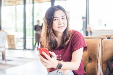 Business women hand use smartphone while sitting in cafe smart women