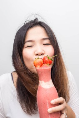 Women with strawberry smoothies summer drink on white background healthy drink