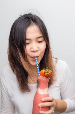 Women with strawberry smoothies summer drink on white background healthy drink