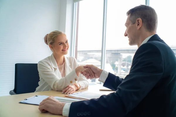 stock image Professinal business man and businesswoman shaking hand in modern office accept cooperation concept