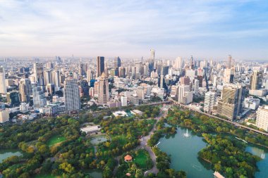 Bangkok downtown city office building with green park sunset aerial view Thailand
