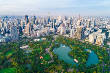 Bangkok downtown city office building with green park sunset aerial view Thailand