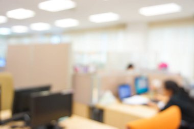 Blurred office interior space background in the workplace with computer shallow depth of focus of abstract background.