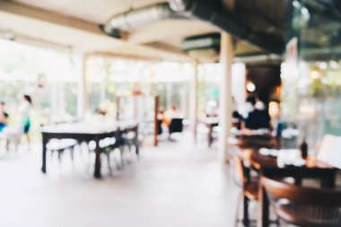 Kafe Bokeh 'te insanların olduğu soyut bulanık kafeler.