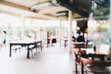 Kafe Bokeh 'te insanların olduğu soyut bulanık kafeler.