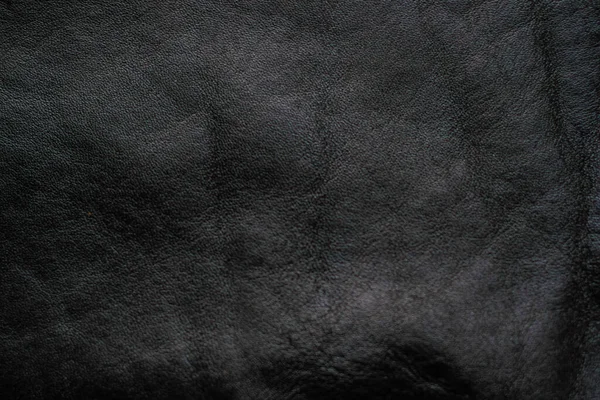 stock image Black genuine cow leather background