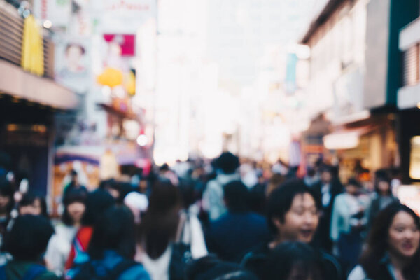 Abstract blurred group of people walking in the city, Tokyo, Japan
