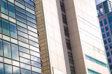 Window office building in Tokyo city against blue sky with cloud uprise view
