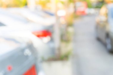 Soyut bulanık açık hava modern otopark arka planı yeşil ağaçla