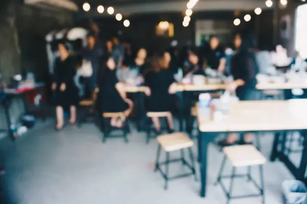 Blurred group of people eating food in restaurant business background