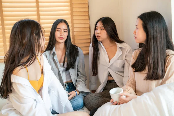 Beautiful asian business women group morning talk together and drink coff on bed, Friend group