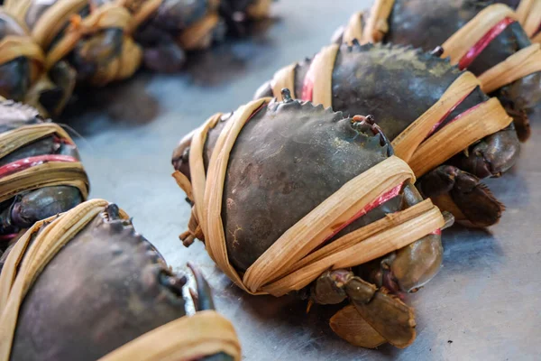 Fresh live sea crabs sell in fisheries market seafood