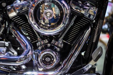 Shiny chrome motorcycle engine with twin piston close up clipart