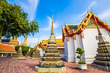 Beautiful pagoda of Wat Pho temple complex against blue sky sightseeing travel in Bangkok, Thailand