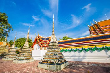 Beautiful pagoda of Wat Pho temple complex against blue sky sightseeing travel in Bangkok, Thailand