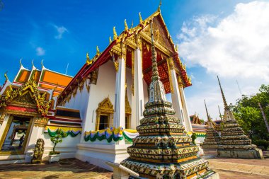Beautiful pagoda of Wat Pho temple complex against blue sky sightseeing travel in Bangkok, Thailand