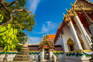 Beautiful pagoda of Wat Pho temple complex against blue sky sightseeing travel in Bangkok, Thailand