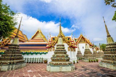 Beautiful pagoda of Wat Pho temple complex against blue sky sightseeing travel in Bangkok, Thailand