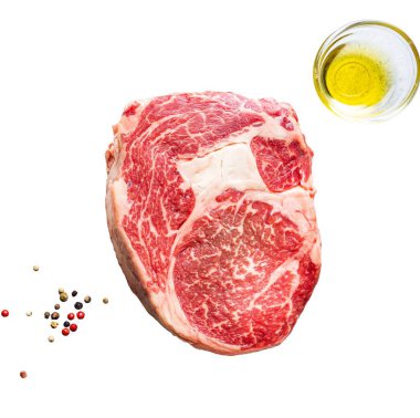 Raw fresh meat Ribeye Steak and seasonings on light background, top view with copy space clipart