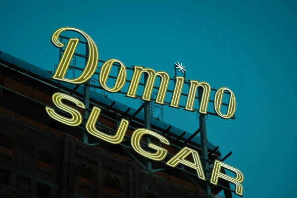 Stock image Domino Sugar neon sign at night, at Domino Park, Brooklyn, New York