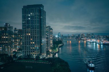 Night view of Roosevelt Island and the East River from Queensboro Bridge, Manhattan, New York City clipart