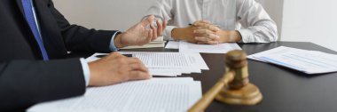 Lawyer and legal concept, Senior lawyer give legal advice regarding legality of business contract.