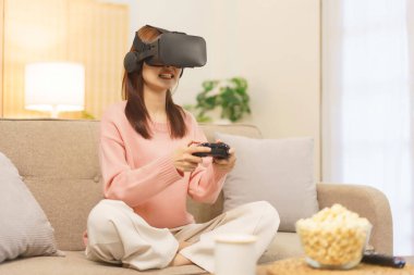 Lifestyle at home concept, LGBT lesbian women playing game in really virtual with joystick console.