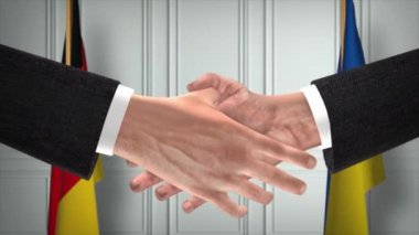 Almanya ve Ukrayna diplomasi animasyon ticareti yapıyor. İş adamı ortağı tokalaşması. Arka planda ulusal bayrak