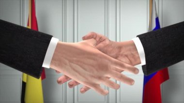 Belçika ve Rusya el sıkışma, siyaset illüstrasyonu. Resmi toplantı ya da iş birliği, iş görüşmesi. İş adamları veya politikacılar el sıkışıyor