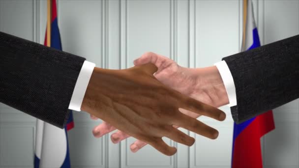 ラオスとロシアは握手 政治イラストを扱う 正式な会議や協力 ビジネスミーティング ビジネスマンや政治家が握手をする — ストック動画