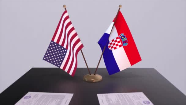 交渉テーブル 外交協定でクロアチアと米国 ビジネスと政治のアニメーション 国旗外交協定だ 机の上の書類 国際協定 — ストック動画