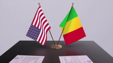Mali ve ABD müzakere masasında, diplomatik bir anlaşma. İş ve politika animasyonu. Ulusal bayraklar, diplomasi anlaşması. Kağıt belgeler masanın üstünde. Uluslararası anlaşma