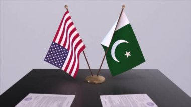 Pakistan ve ABD müzakere masasında, diplomatik bir anlaşma. İş ve politika animasyonu. Ulusal bayraklar, diplomasi anlaşması. Kağıt belgeler masanın üstünde. Uluslararası anlaşma
